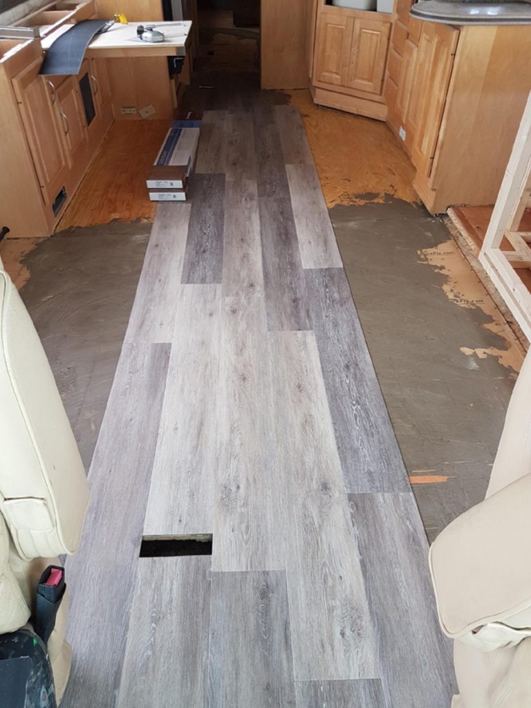 Installation of vinyl plank flooring in our Monaco