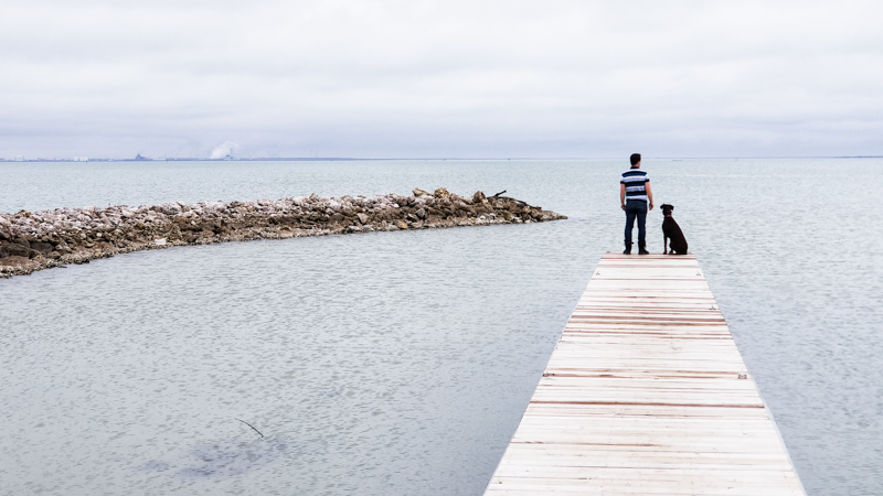 Kevin and Coconut on a dock near Magnolia Beach