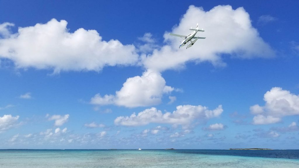 Float plane over Spoil Cay in The Bahamas